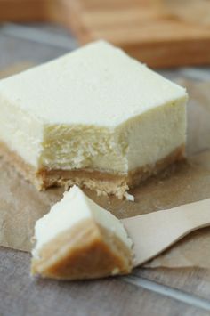 a piece of cake sitting on top of a brown paper bag next to a knife