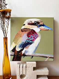 a painting of a bird sitting on top of a table next to a vase with flowers