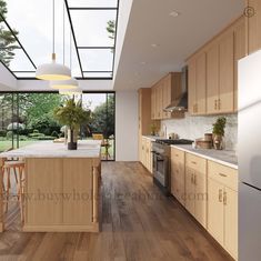 a kitchen with wooden floors and white walls