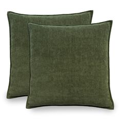 two green pillows sitting next to each other