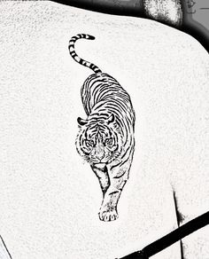 a black and white photo of a tiger on the back of a shirt that has been drawn