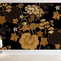 the wallpaper is decorated with gold leaves and flowers