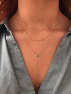 Add a touch of drama to your necklace story. 1 pear Emerald, 0.21ct, lies at the heart of the piece, surrounded by a Diamond halo and finished with a single round bezeled Diamond at the end of the lariat. (0.07tcw Diamonds, SI clarity, G-H color). Beautiful for V-necklines, this piece can be dressed up for your most special occasions or dressed down for everyday elevation. Adjustable length: 18-20'' Please note that no two stones are alike, therefore slight stone variations might be present. Diy Jewelry Necklace, Single Stone, Pear Diamond, Fine Jewelry Collection, Diamond Halo, Emerald Diamond, Layered Look, Jewelry Necklace, Minimalist Jewelry