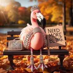 a pink flamingo sitting on top of a bench with a sign that says need more bling