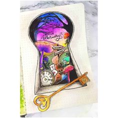 an open keyhole with the words happy birthday written on it and some other items inside