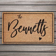 a door mat that says the benefits are in black ink on it, and is placed next to a wooden wall