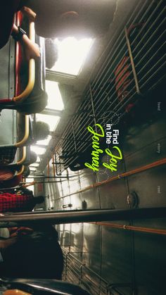 the interior of a subway car with neon green lettering