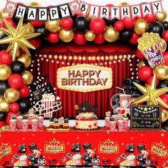 an image of a birthday party scene with balloons and streamers on the stage backdrop