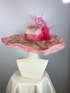 This ivory, pink and green women's straw hat is so pretty! It is completely handmade, hand blocked and one of a kind. The hat is topped with a sinamay straw brim that I tinted then embellished with a leafy vine. It's further embellished with a peachy pink silk band, handmade silk flower and wispy distressed crinoline. It is perfect for a special occasion like Kentucky Derby, Kentucky Oaks, church or summer garden party. The Wide brim makes a statement, as does the slightly asymmetrical crown. A Elegant Handmade Flat Brim Straw Hat, High Crown Sun Hat For Spring Vacation, High Crown Straw Hat For Vacation, High Crown Straw Hat For Beach, High Crown Hats For Spring, Whimsical Handmade Straw Hat For Summer, Bohemian Pink Sun Hat For Garden Party, Pink Bohemian Sun Hat For Garden Party, Handmade Summer Party Straw Hat