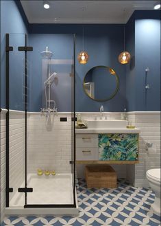 a bathroom with blue walls and white tiles on the floor, along with a walk in shower