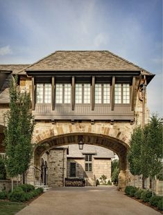 a large stone house with an arched entrance