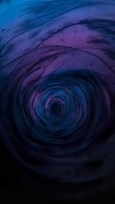 the inside of a blue and purple swirl