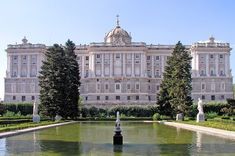 a large building with many trees around it