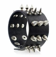 This steampunk wide cuff bracelet is made of pu leather. It has three rows of cone-shaped zinc studs for decorations, an adjustable length of 22.5cm and a hidden safety clasp. You can pair your denim pants with a slim fit t-shirt and finish the look with this bracelet for a concert, festival, party or club. It is the perfect accessory for your steampunk or rock outfit. L*w: 22.5*5cm(8.86*1.97in) Spike Bracelet, Gothic Bracelet, Goth Accessories, Metal Spikes, Wide Cuff Bracelets, Rock Outfits, Leather Wristbands, Gothic Rock, Rock Punk