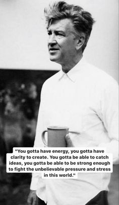 a man holding a coffee cup in his right hand and a quote on the left