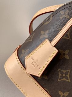 The LV Alma BB handbag introduced in 1934. Over time it has gradually evolved from a square corner travel bag to a representative of today’s elegant women’s handbags. This mini bag in Monogram canvas easily holds keys, wallet, cell phone and lipstick. The Alma BB bag comes with a strap that adjusts the bag to ... Alma Bb Monogram, Lv Alma Bb, Lv Alma, Bb Monogram, Alma Bb, Leather Trim, Monogram Canvas, Canvas Bag, Cowhide Leather