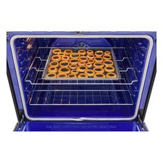 an open oven with glazed donuts in the front and bottom racks on each side