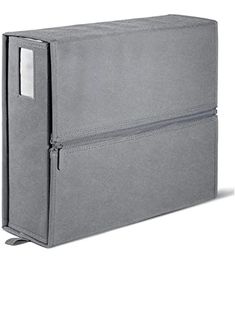 a large gray box with two zippers on the front and one in the back