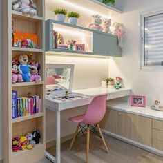 a child's room with toys on the desk and bookshelves in it