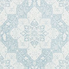 a blue and white wallpaper with an intricate design