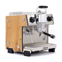 an espresso machine sitting on top of a wooden stand