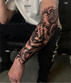 a man with a tattoo on his arm