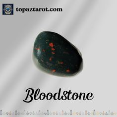 a black rock with red speckles on it and the words blood stone above it