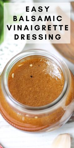 an easy balsamic vinaigrete dressing in a glass jar with garlic on the side