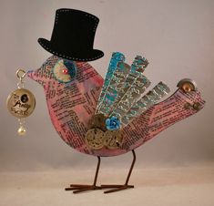 a bird with a top hat and keychain on it's head is standing in front of a white background