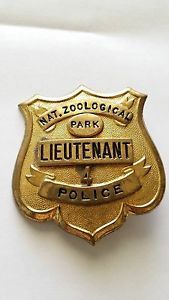 a police badge is shown on a white surface