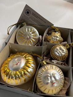 some ornaments are in a box on a table