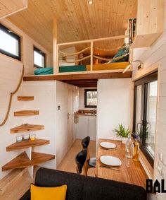 the interior of a tiny house with stairs