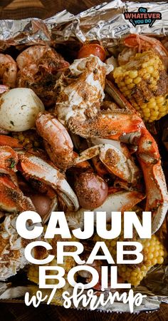 the cover of cajun crab boil with corn on the cob and potatoes in foil