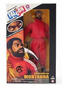 the action figure is shown in its box, and has a red uniform on it