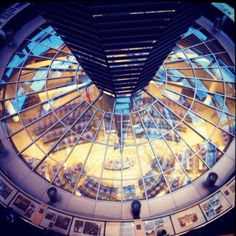 an overhead view of the inside of a building with many pictures on display in it