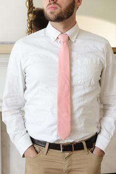 Elevate your man's professional attire with the Max Mens Tie in Spring Pink. Featuring a classic Easter pink, this self-tie style allows for a comfortable fit every time. Stay stylish and polished with this versatile accessory. Perfect for matching the fam! Tailored Professional Standard Tie, Cotton Ties For Workwear In Spring, Classic Ties For Spring, Tailored Tie For Workwear, Classic Pink Tie For Black Tie Events, Classic Spring Suit And Tie Accessories For Semi-formal, Classic Tie For Semi-formal Spring Occasions, Classic Semi-formal Ties For Spring, Classic Ties For Semi-formal Spring Occasions