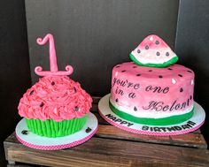 two cakes decorated with pink and green frosting on top of each other in the shape of watermelon