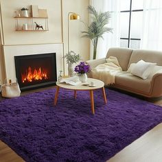 a living room filled with furniture and a fire place