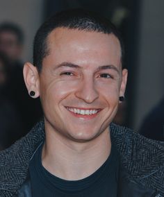 a close up of a person with a smile on his face