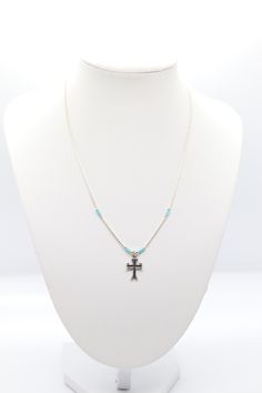 This beautiful turquoise beaded silver cross necklace is the perfect accessory for any occasion. It's sure to become a favorite. Turquoise Beaded Pendant Jewelry, Blue Bohemian Necklace With Cross Pendant, Bohemian Blue Cross Pendant Necklace, Spiritual Sterling Silver Beaded Necklace, Spiritual Beaded Cross Pendant Necklace, Silver Beaded Cross Pendant Necklace, Beaded Cross Pendant Jewelry Gift, Silver Beaded Cross Pendant Jewelry, Bohemian Beaded Cross Pendant Jewelry