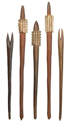 five different types of wood carving tools lined up in a row on a white background