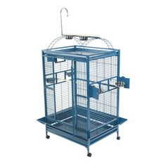 a blue bird cage sitting on top of a metal stand