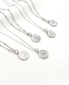 "Beautifully detailed dainty SILVER zodiac coin disc, suspended on a delicate diamond cut chain. You can select a zodiac sign. Great birthday gift for someone you love! This listing is for one (1) dainty SILVER or GOLD zodiac coin necklace, please select color. The necklace in the last photo with a birthstone is available here: https://etsy.me/3eBVOSl GOLD VERSION available: https://etsy.me/31r5J9D | H O W * T O * O R D E R | * silver or Gold zodiac sign: please select an option. * chain type(Di Coin Necklace Gold, Leo Necklace Zodiac, Constellation Jewelry, Astrology Jewelry, Zodiac Pendant Necklace, Horoscope Necklace, Gold Coin Necklace, Celestial Necklace, Scorpio Sagittarius