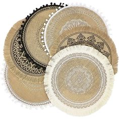 four round woven placemats with tassels on them