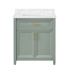 a bathroom vanity with a marble top and two gold handles on the door knobs