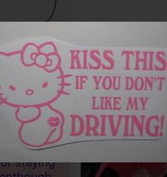 the hello kitty sticker is pink and says, kiss this if you don't like my driving