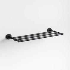 a black towel rack on the wall