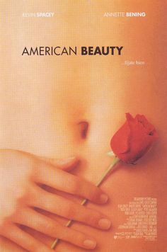 an ad for american beauty with a rose on the breast and hand holding it up