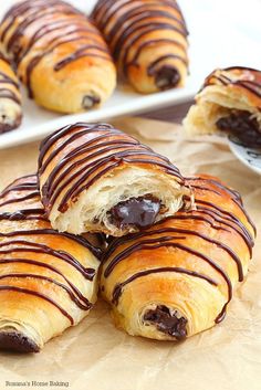 chocolate covered croissants are sitting on a table