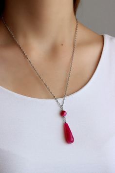 This bright pendant necklace was made of bright pink agate teardrop stone bead, small faceted pink agate stone 8 mm bead, small steel beads and cable stainless steel chain with stainless steel lobster claw. Perfect jewelry for everyday wear or a wonderful gift for someone special! The length of necklace is about 51 cm or 20.1 inch. Please,note: The color of the live product may some differ from the photo depending on the brightness settings of your monitor. Other necklaces of my shop you can see Polished Onyx Beads Necklaces, Drop Necklace Silver, Black Gemstone Necklace, Pink Gemstone Necklace, Silver Drop Necklace, Black Onyx Jewelry, Onyx Jewelry, Pink Agate, Agate Jewelry